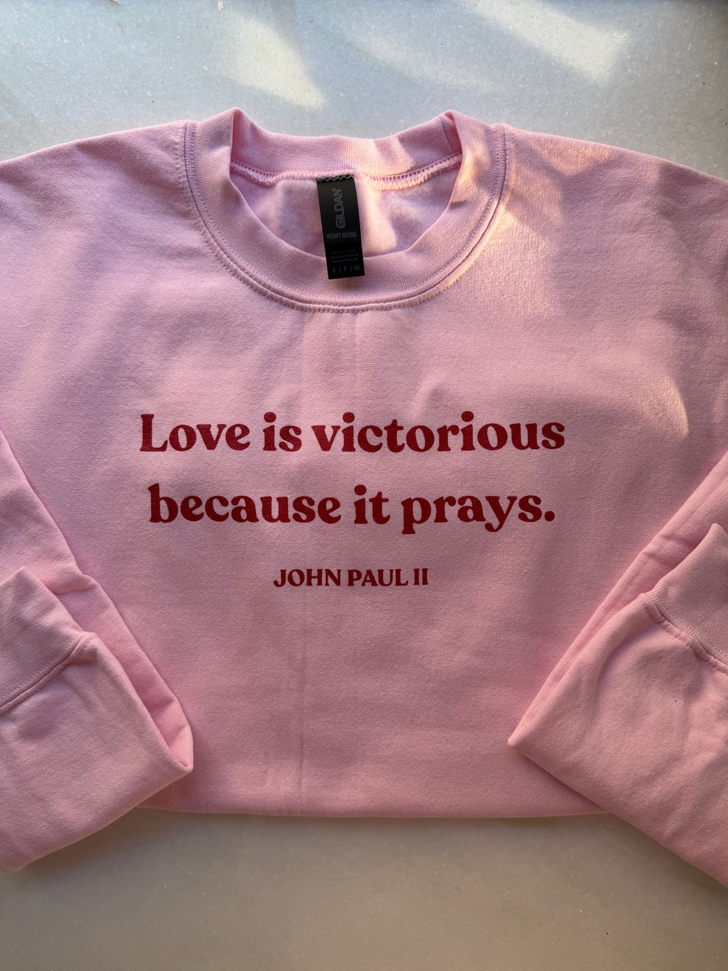 Sweatshirt - "Love is victorious because it prays." John Paul II